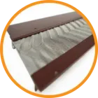 Brown metal eavestrough with a zig-zag metal mesh guard.