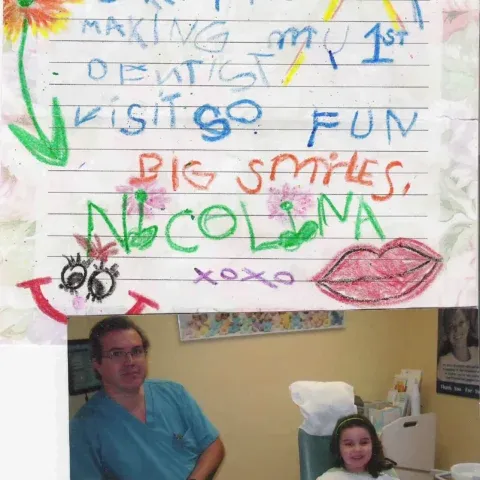 Colorful hand-lettered poster above two seated people in a room, with drawings and “Big smiles” text.