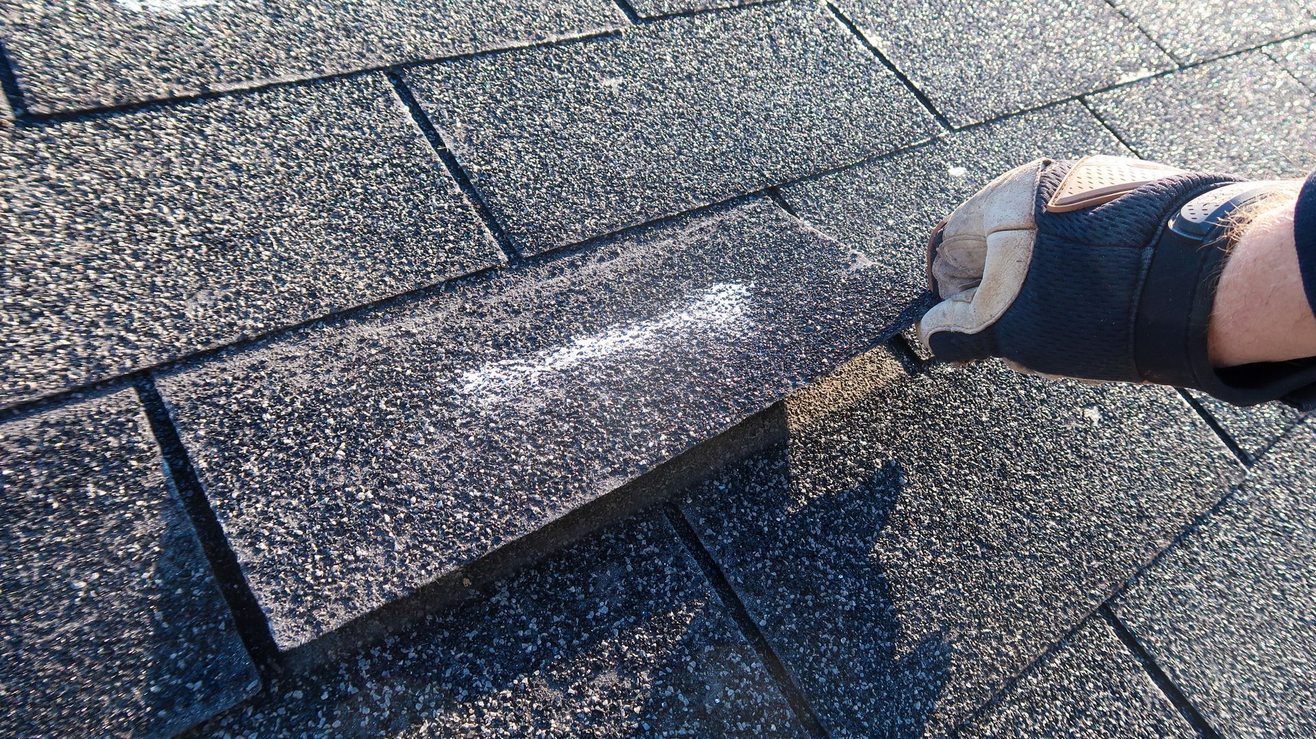 A person is checking a roof