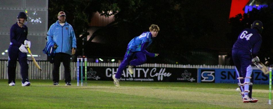 A man is playing a game of cricket on a field.