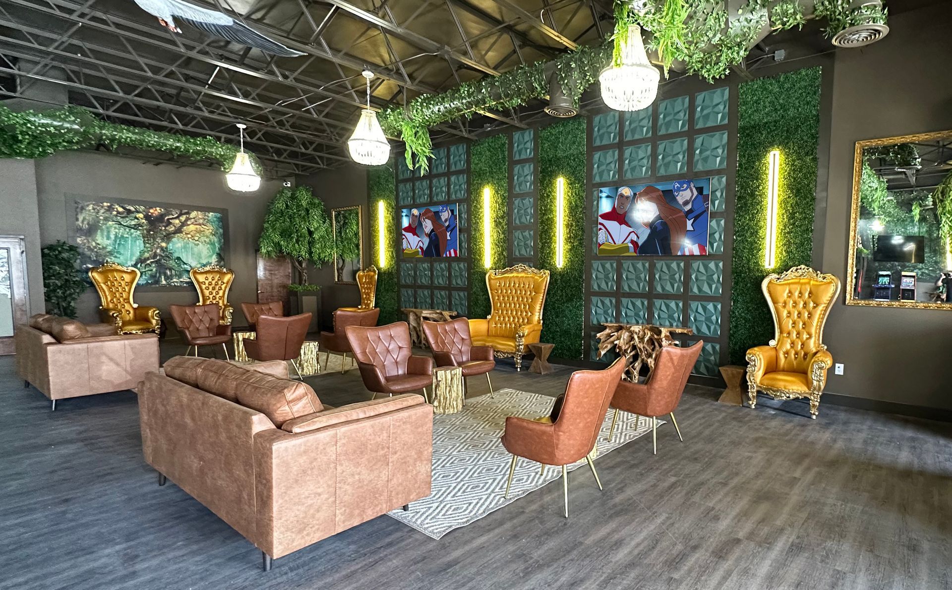 Stylish indoor lounge with wicker chairs, tan sofas, green walls, and hanging lights under a thatched ceiling