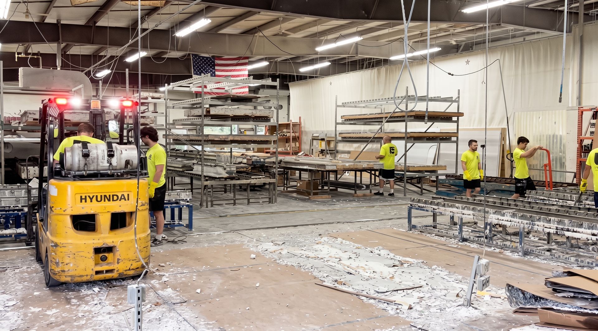 Warehouse interior with a yellow forklift and workers amid scattered debris and shelving