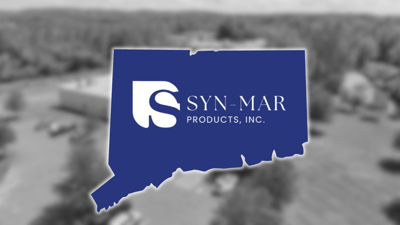 Blue map-shaped logo with white “Syn-Mar Products, Inc.” text over a blurred industrial background