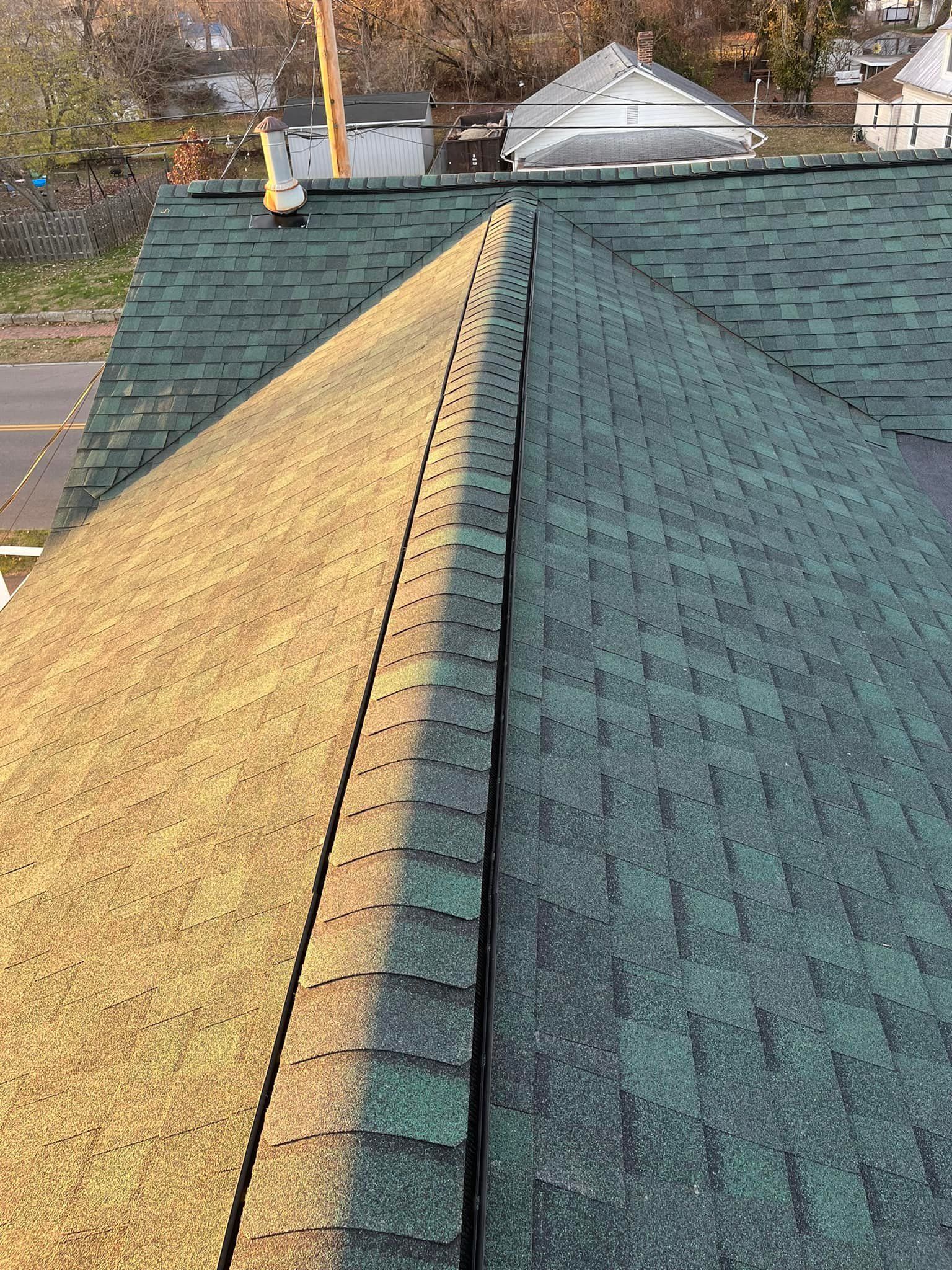 A close up of a roof with shingles on it.