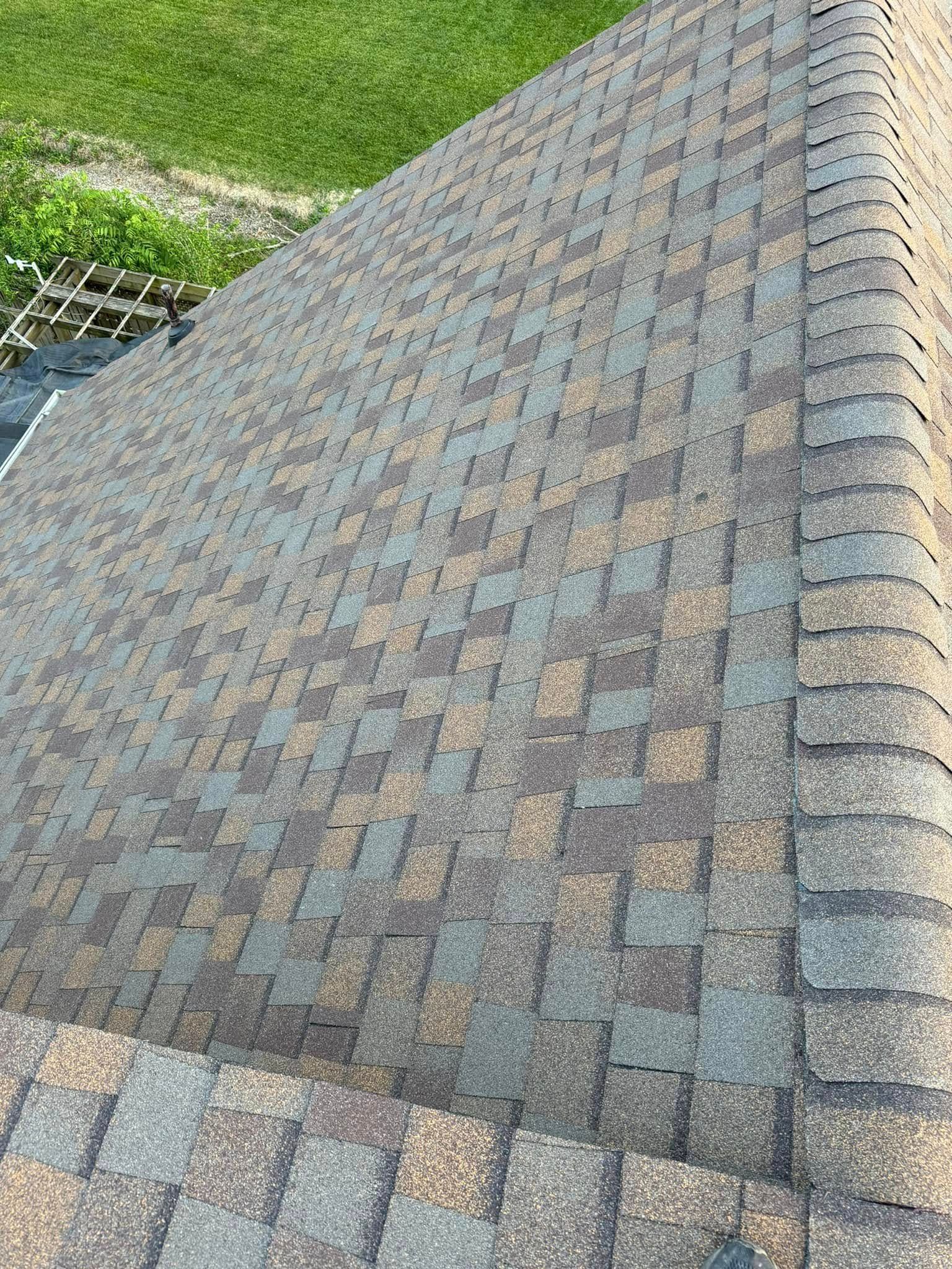 A close up of a roof with shingles on it.