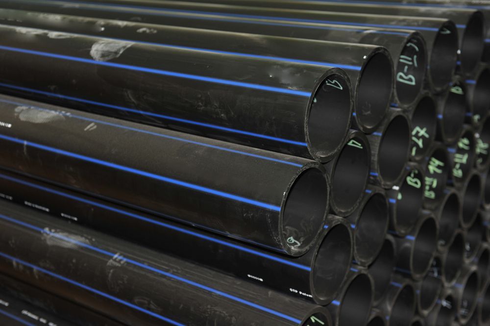A Bunch Of Black Pipes With Blue Stripes — Ram Star Plastics In Winnellie, NT