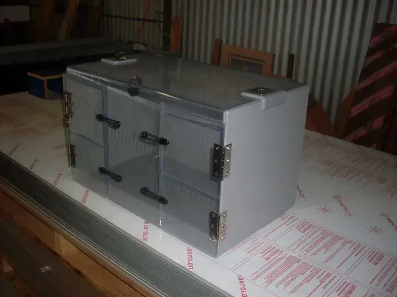 A Small Acrylic Box Is Sitting On Top Of A Wooden Table — Ram Star Plastics In Winnellie, NT