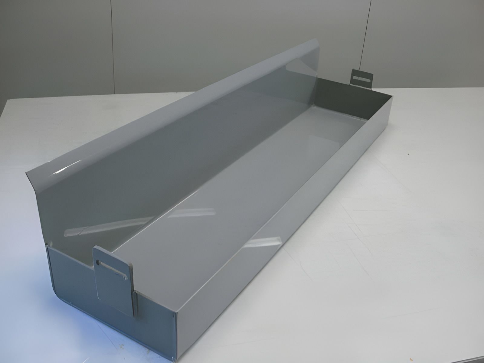 A Long Gray Box Is Sitting On A White Table — Ram Star Plastics In Winnellie, NT