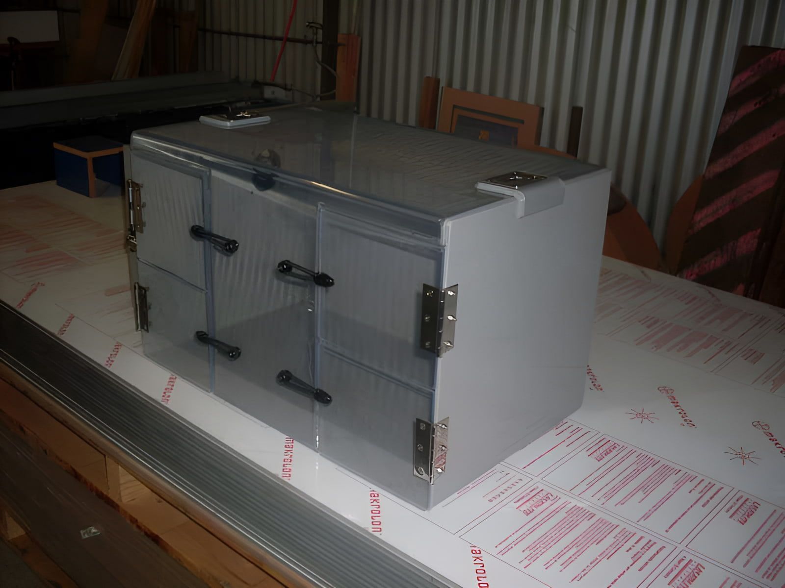 A Small Gray Box Is Sitting On Top Of A Piece Of Plastic — Ram Star Plastics In Winnellie, NT