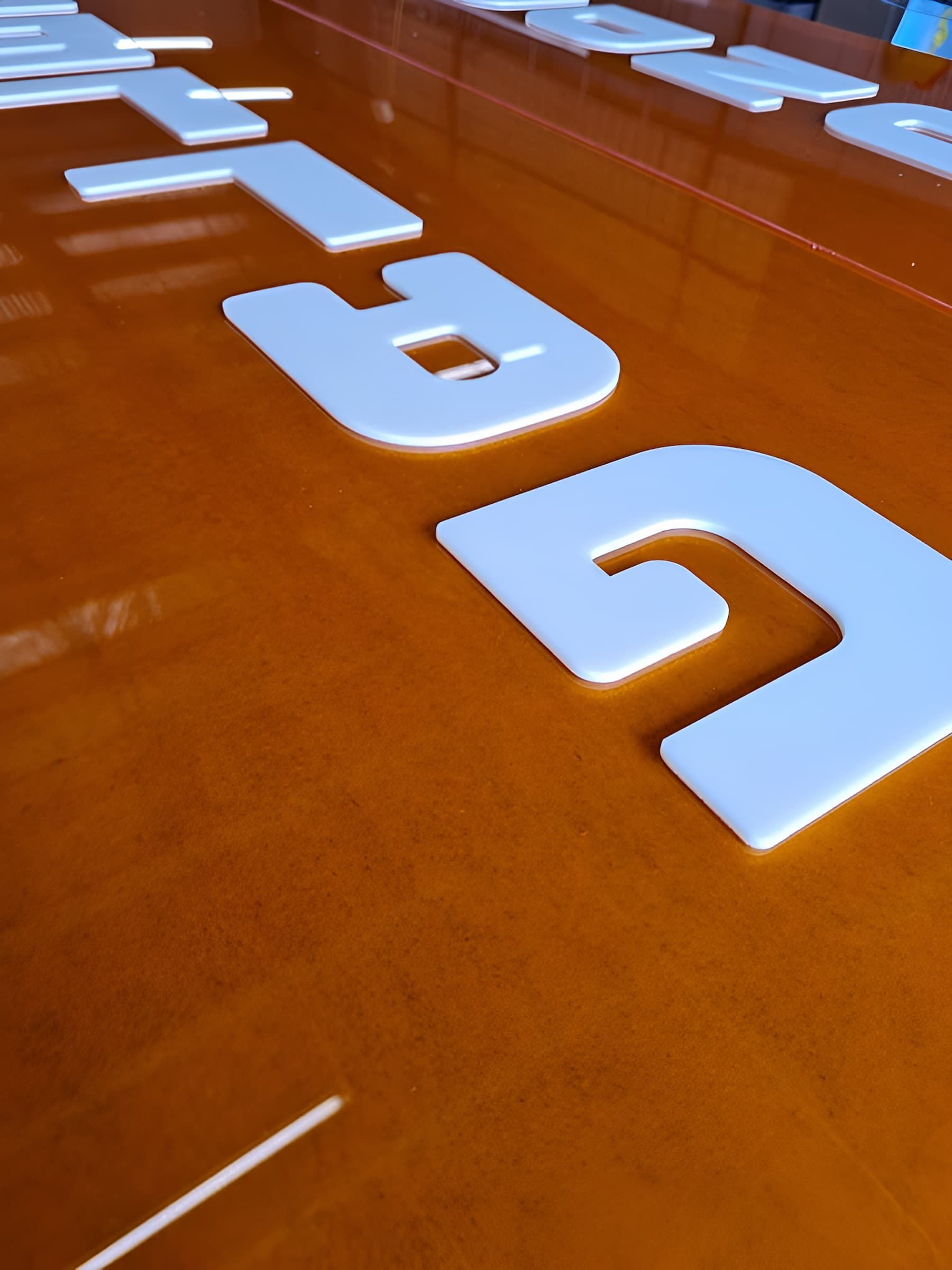 A Brown Table With White Letters — Ram Star Plastics In Winnellie, NT