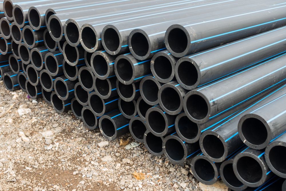 A Pile Of Plastic Pipes Stacked On Top — Ram Star Plastics In Winnellie, NT