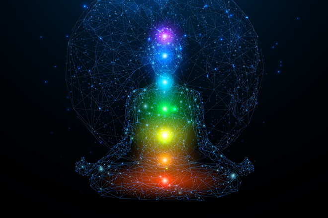 Glowing rainbow chakra lights aligned vertically inside a blue wireframe human head silhouette