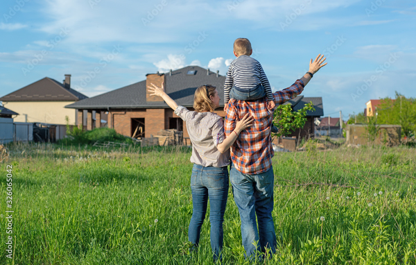 Family looking at house