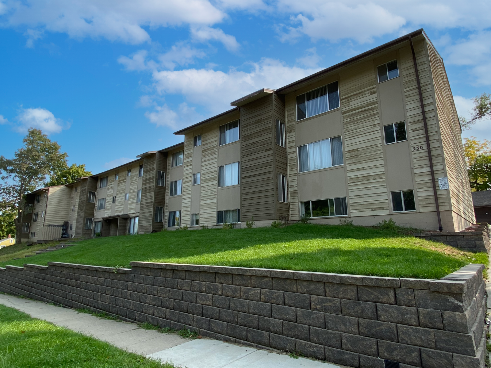 Exterior view of 230 Hyland, a modern apartment building in Ames, IA, offering convenient living spaces close to local amenities and ISU.