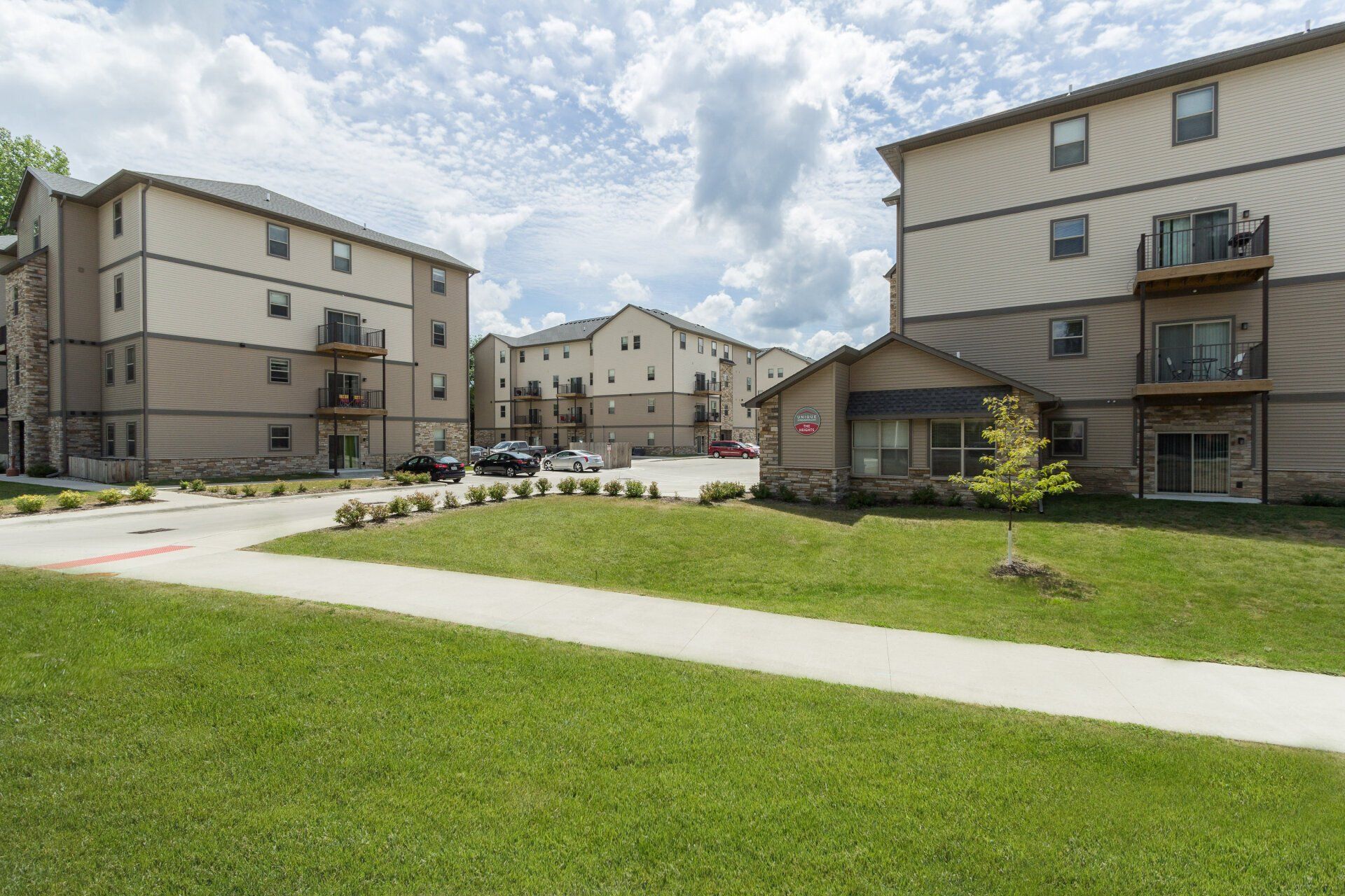 Exterior view of The Heights at Lincoln Swing, a modern apartment complex in Ames, IA offering convenient living spaces close to local & ISU amenities.