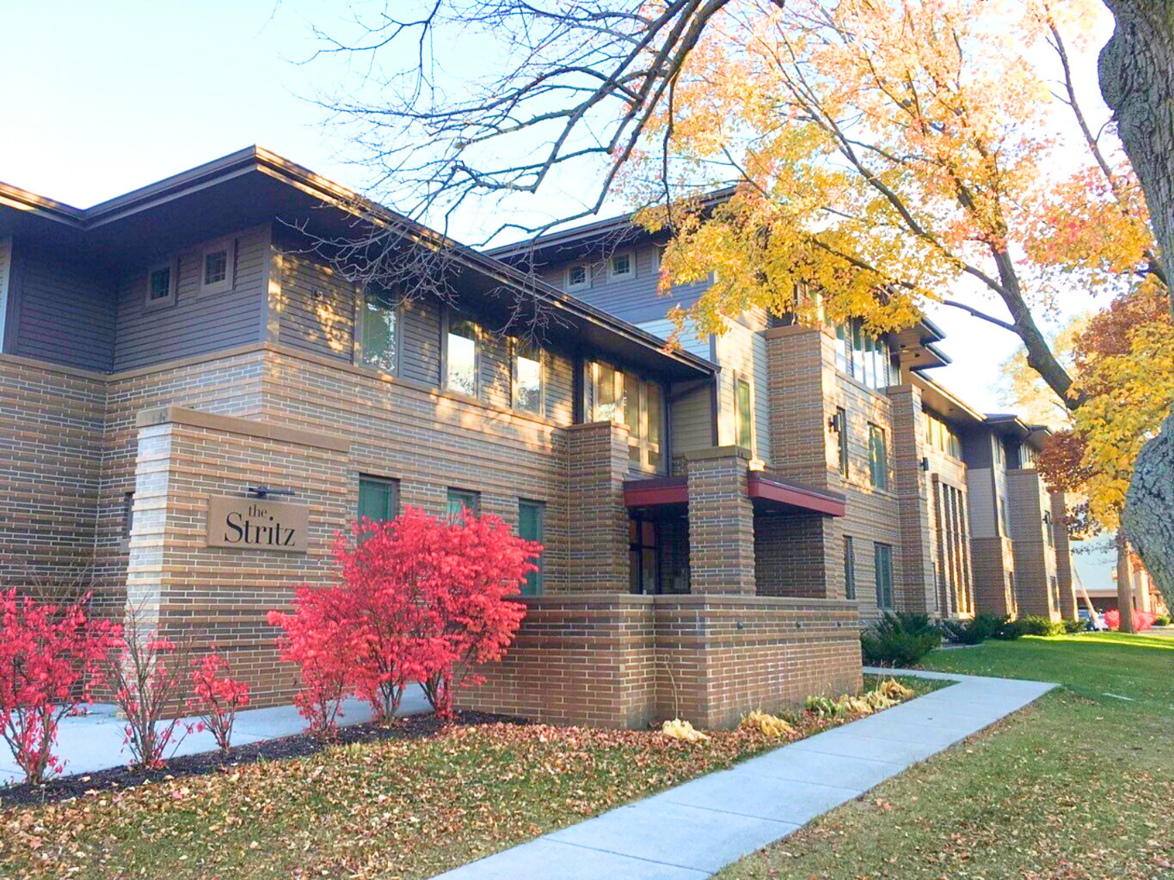Exterior view of The Stritz, a modern apartment building in Ames, IA offering convenient living spaces close to ISU amenities.
