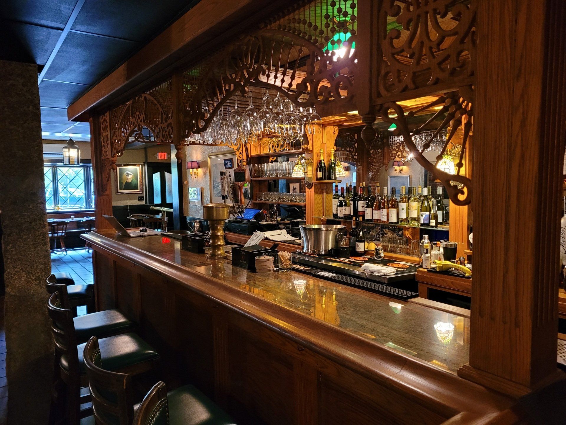 A bar with a lot of bottles of alcohol on it