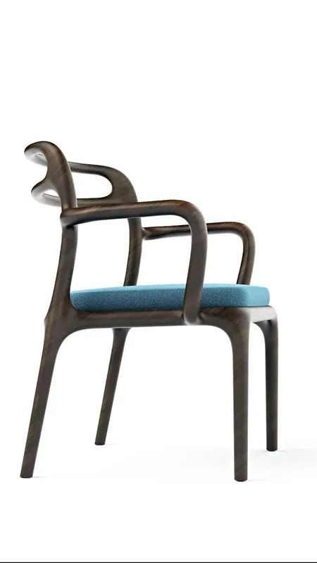 Sedia moderna in legno con seduta e schienale imbottiti di blu, vista di profilo su sfondo bianco.