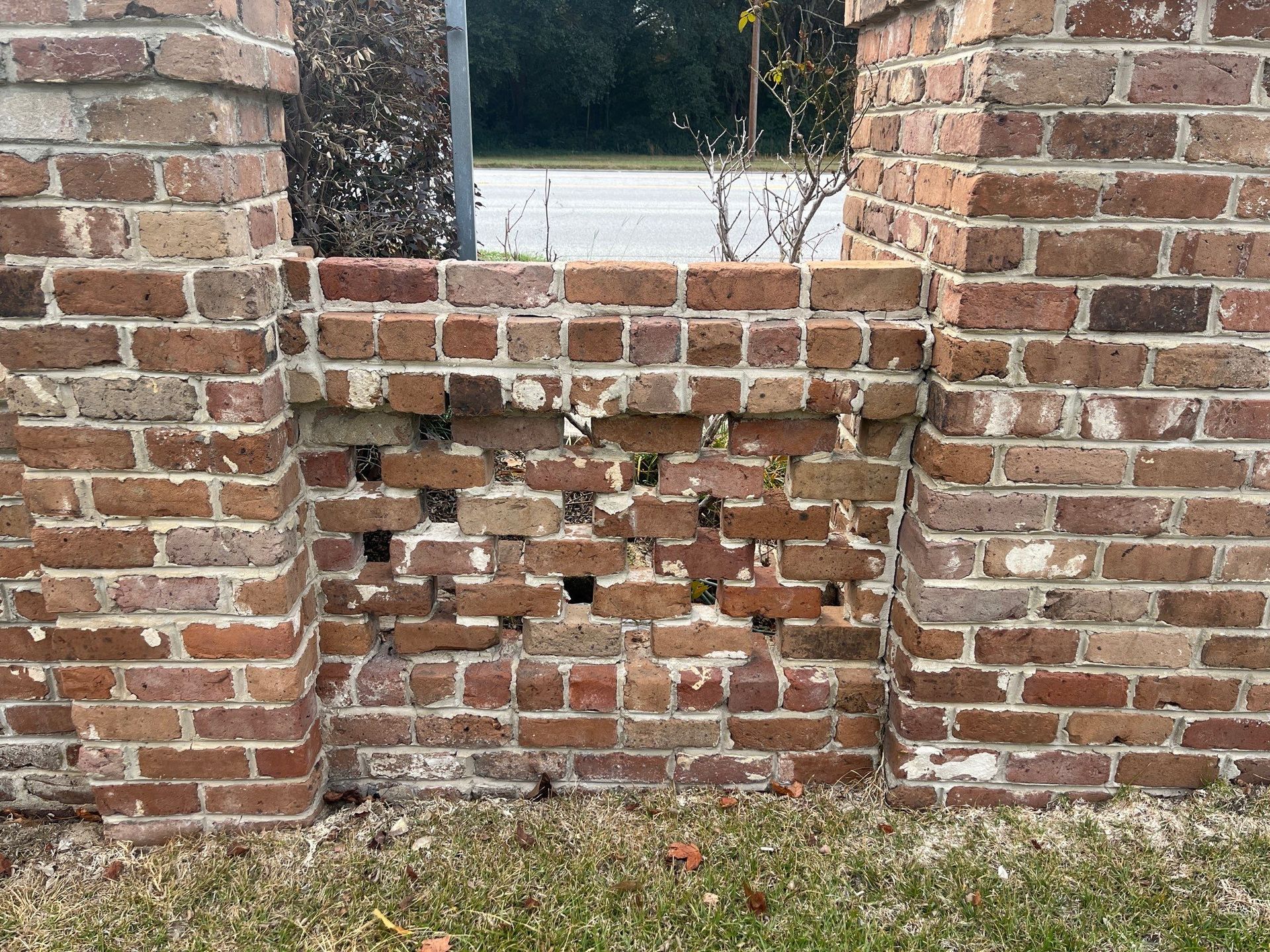 a brick wall with a hole in it