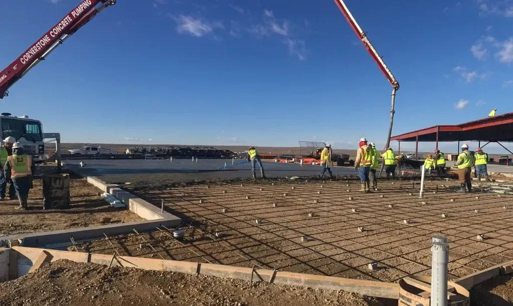 A group of construction workers are working on a construction site