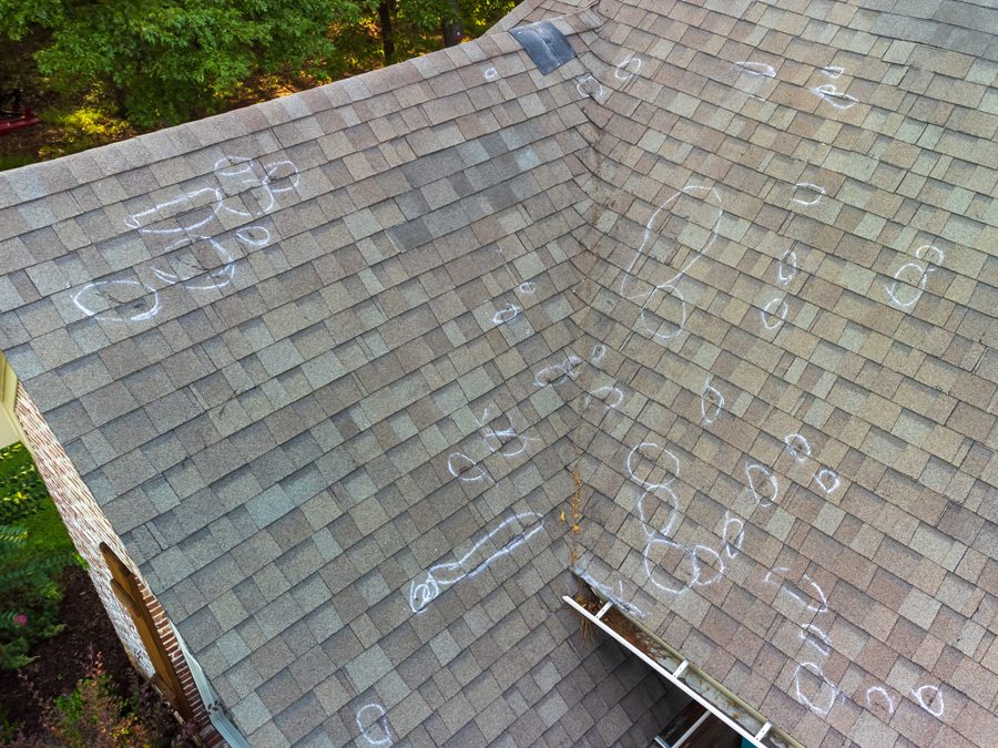 An aerial view of a roof with a lot of damage.