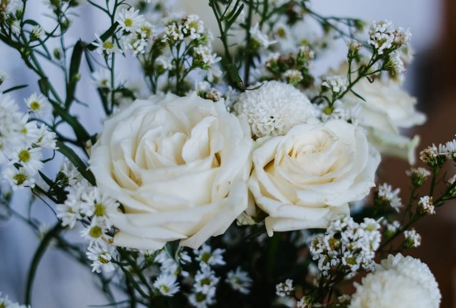 Elegant white roses and delicate filler flowers create a calm tribute, Hudson Oaks, TX