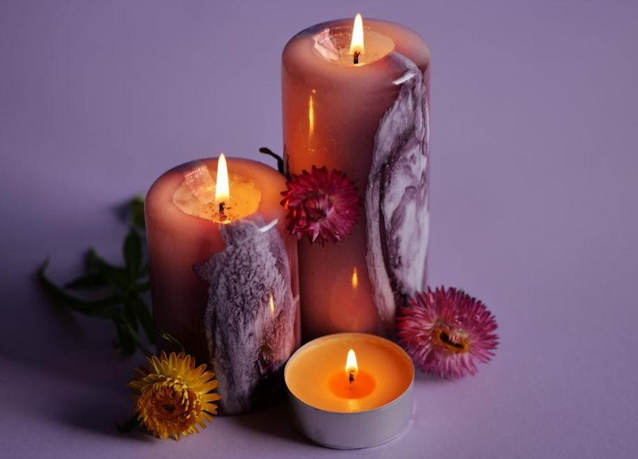 Glowing candles and pink blooms arranged for a memorial, Willow Park, TX cremation