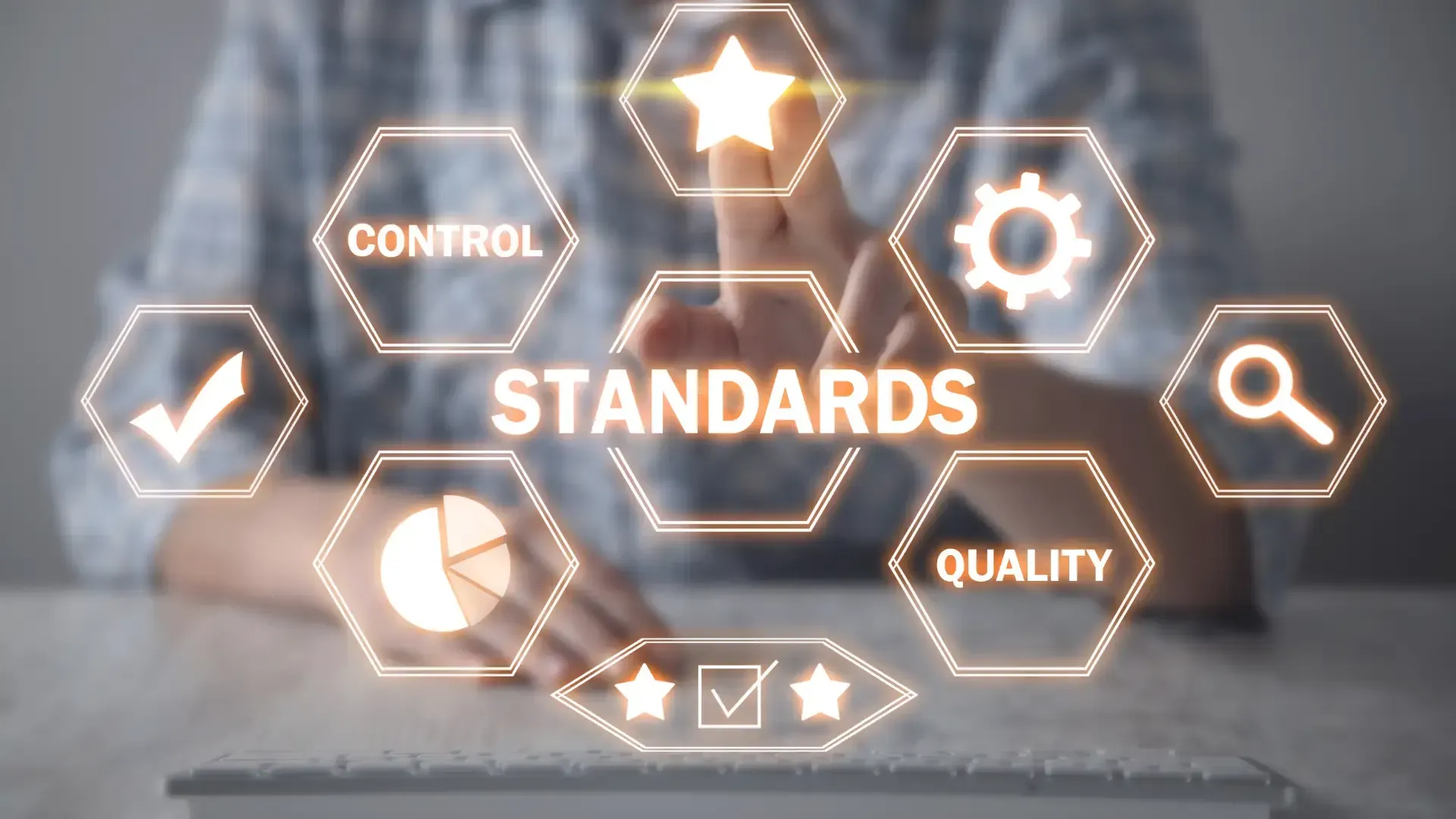 A person is using a tablet with a screen that says standards.