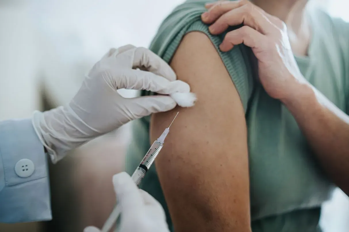 woman getting covid-19 vaccine