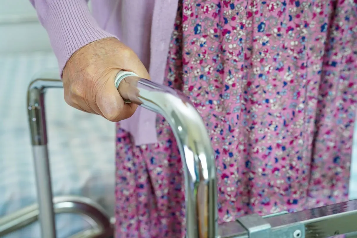 elderly woman disability patient walk with walker