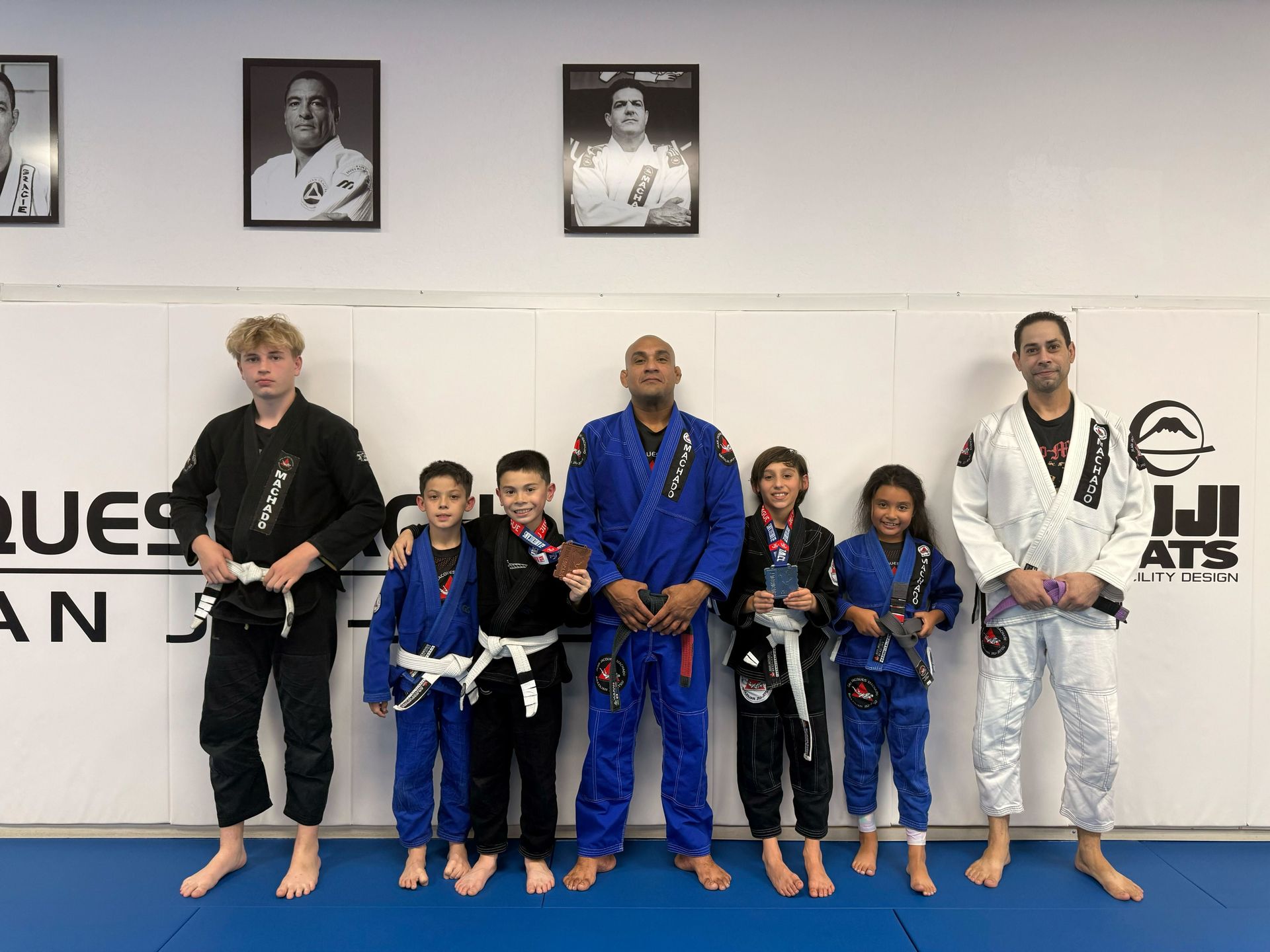 Adults practicing Brazilian Jiu-Jitsu drills at Jean Jacques Machado Fresno in Fresno, CA to build confidence and teamwork.