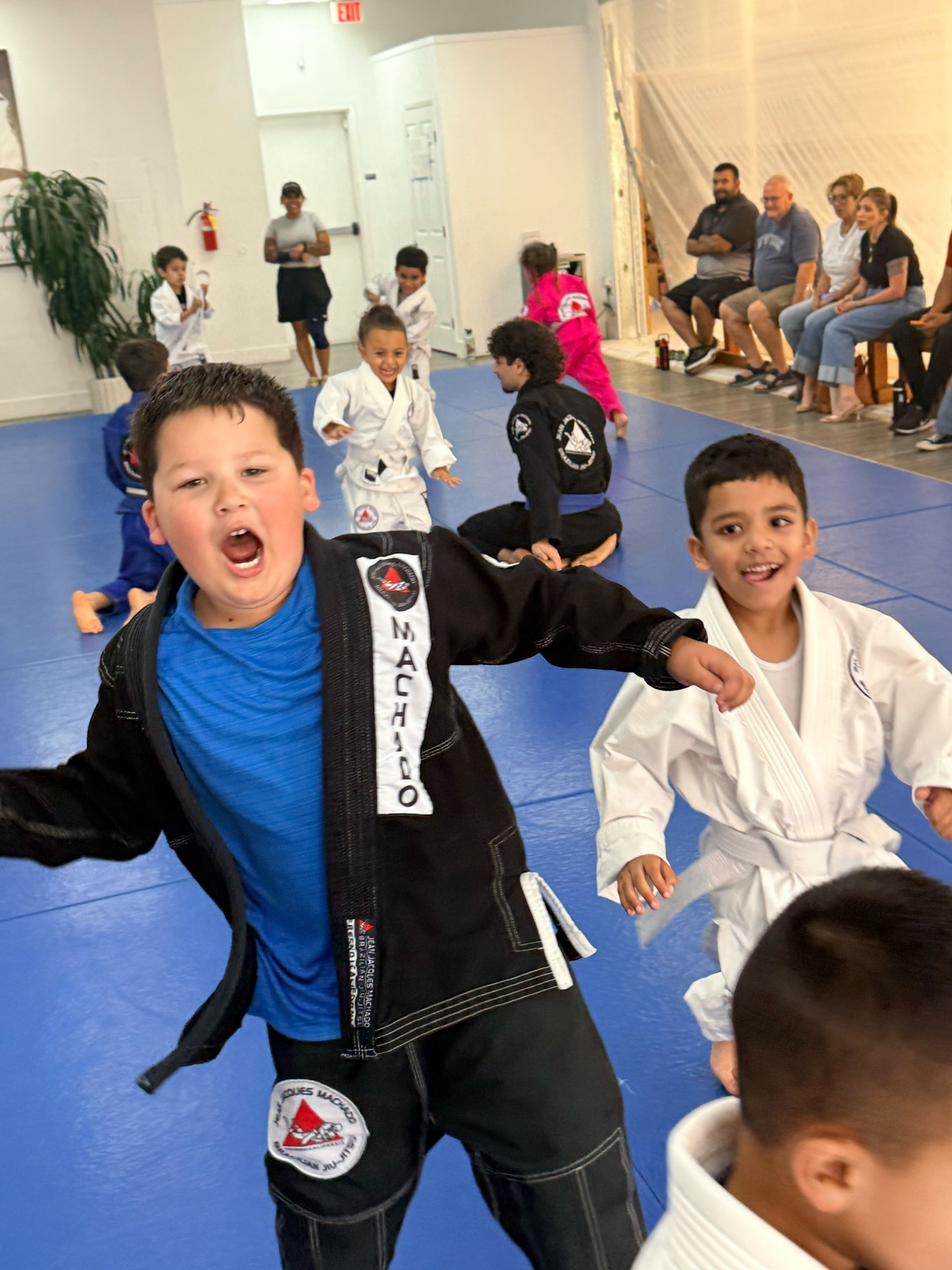 Kids practicing Brazilian Jiu-Jitsu drills at Jean Jacques Machado Jiu-Jitsu Fresno in Fresno, CA.