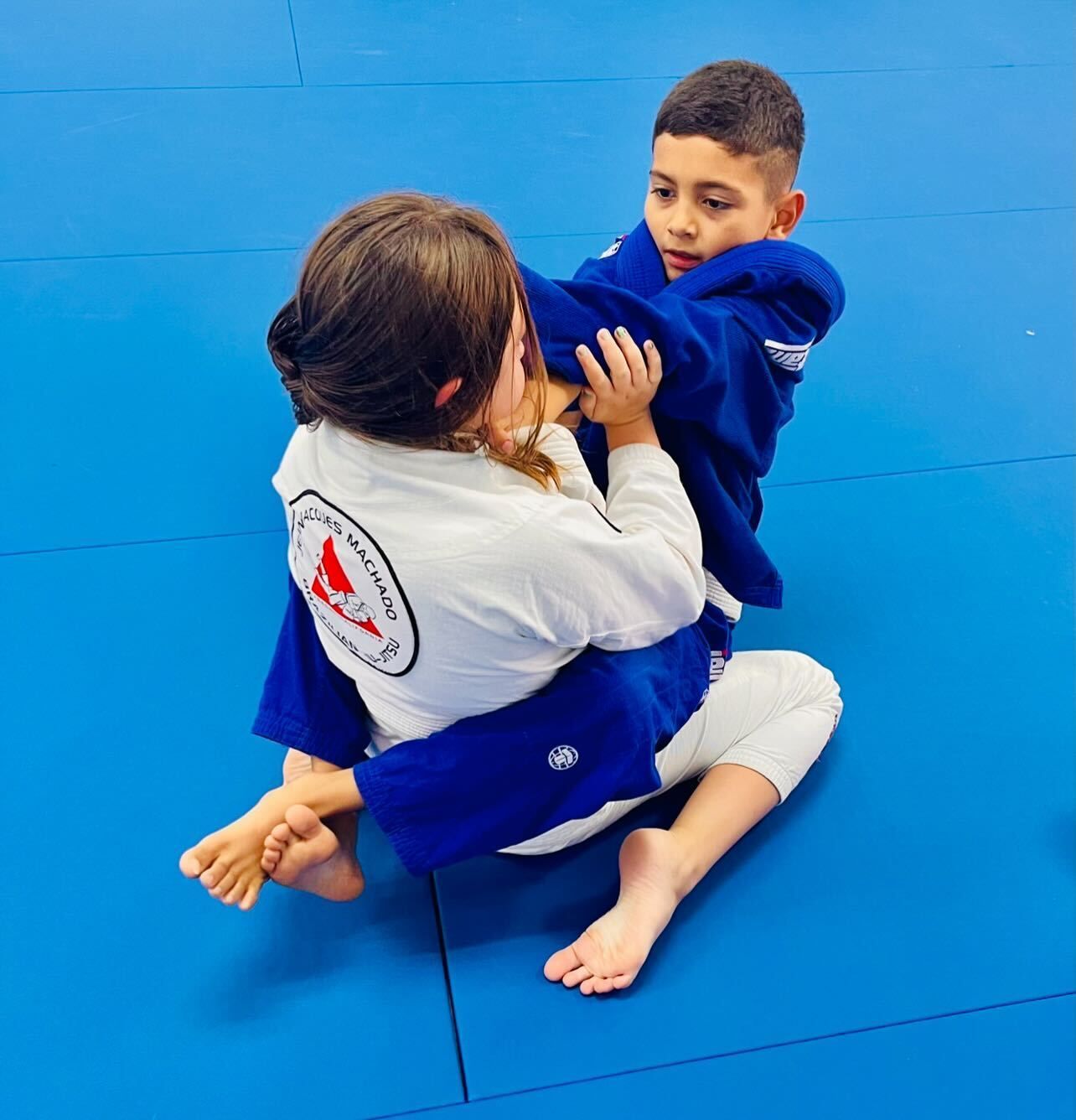 Kids practicing Brazilian Jiu-Jitsu drills at Jean Jacques Machado Jiu-Jitsu Fresno in Fresno, CA.