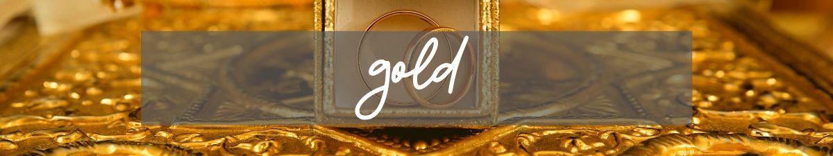 Golden glittering background with a translucent banner and the word “gold” in white script