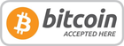 Bitcoin accepted here sign with orange Bitcoin logo and gray text on a white background