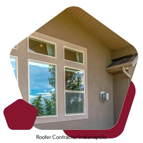 The exterior of a beige stucco home with multiple windows and a downspout against a dark red graphic background.