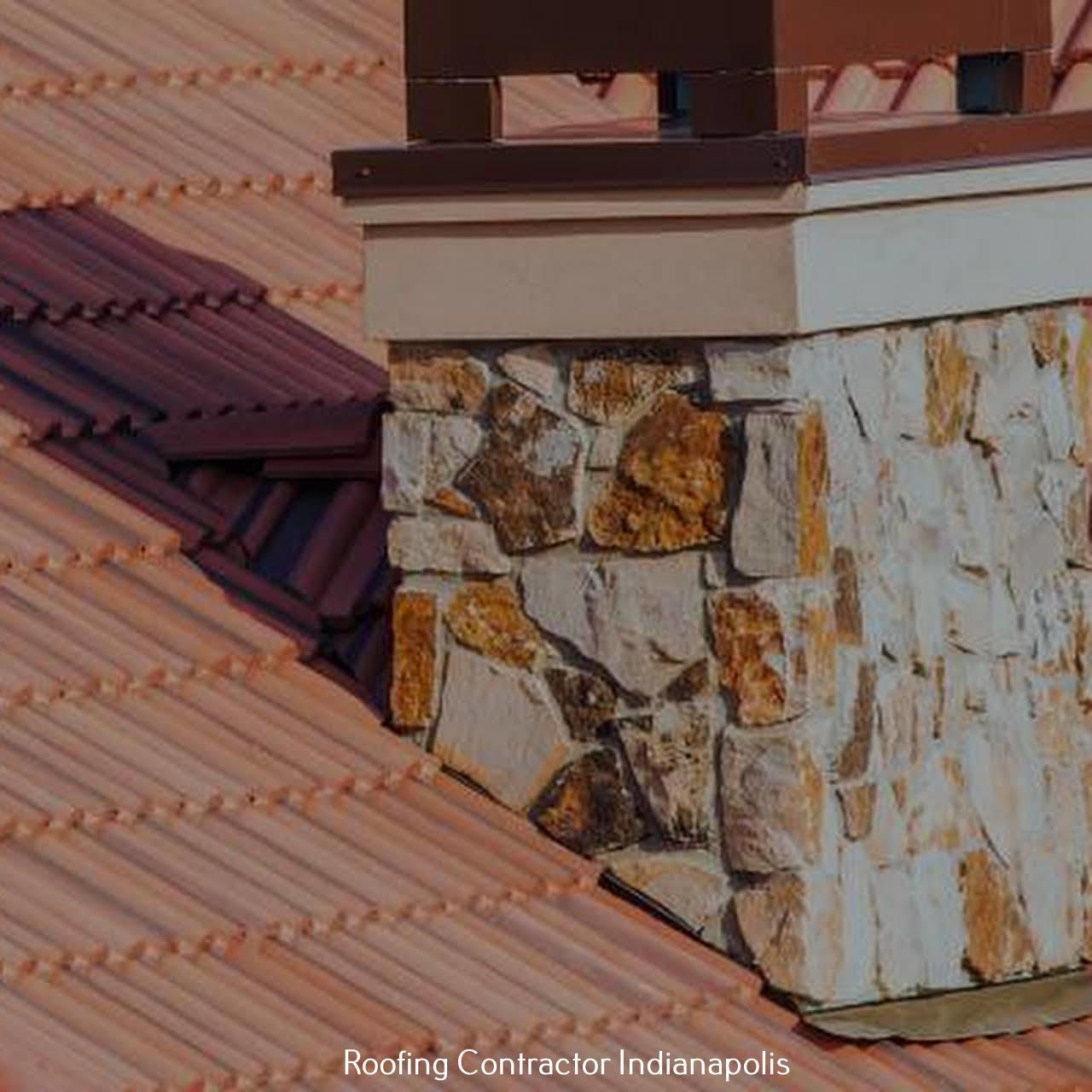 A stone chimney stack rising through a terracotta tile roof, with a metal flashing detail at the base.