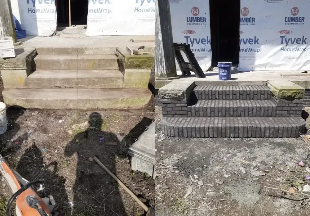 Construction site with steps, stacked pavers, and wrapped windows under renovation