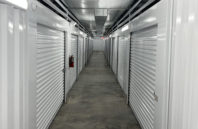 indoor storage units at anchored away storage facility, unit doors closed white doors