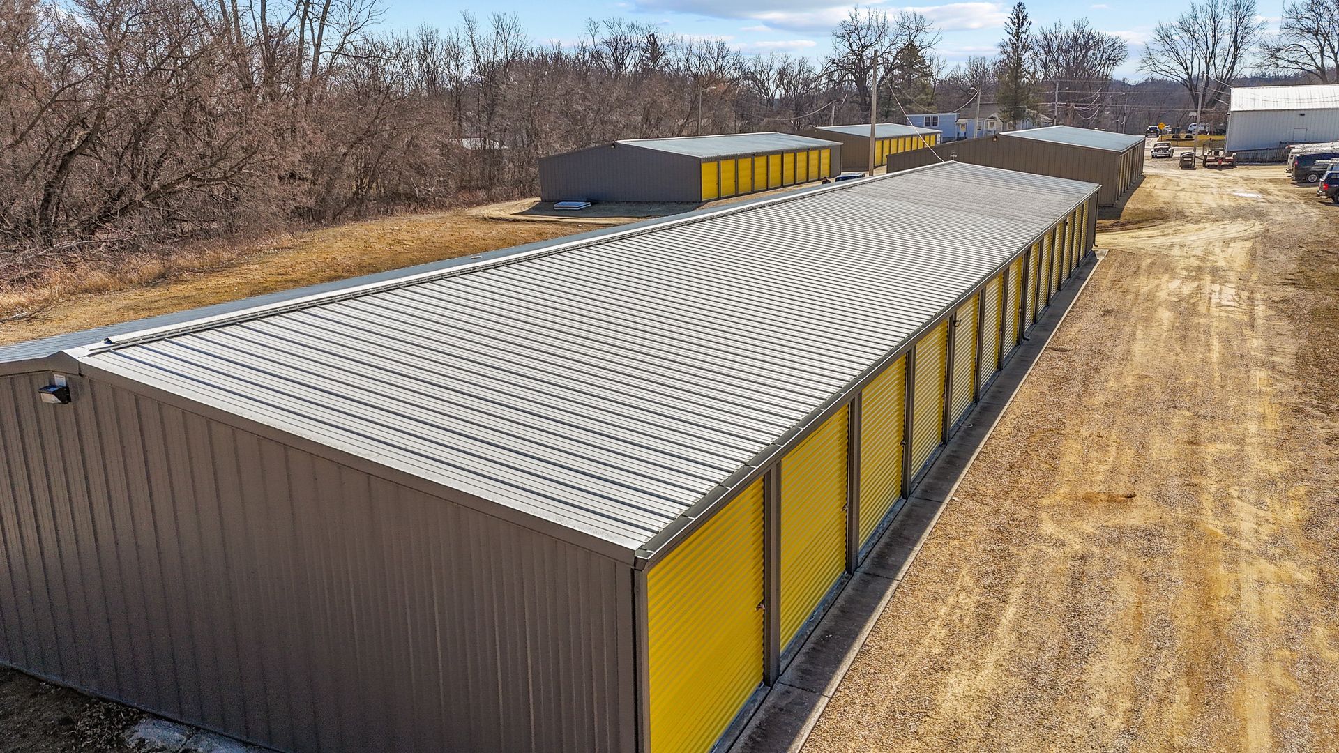An aerial view of a storage facility with yellow doors.