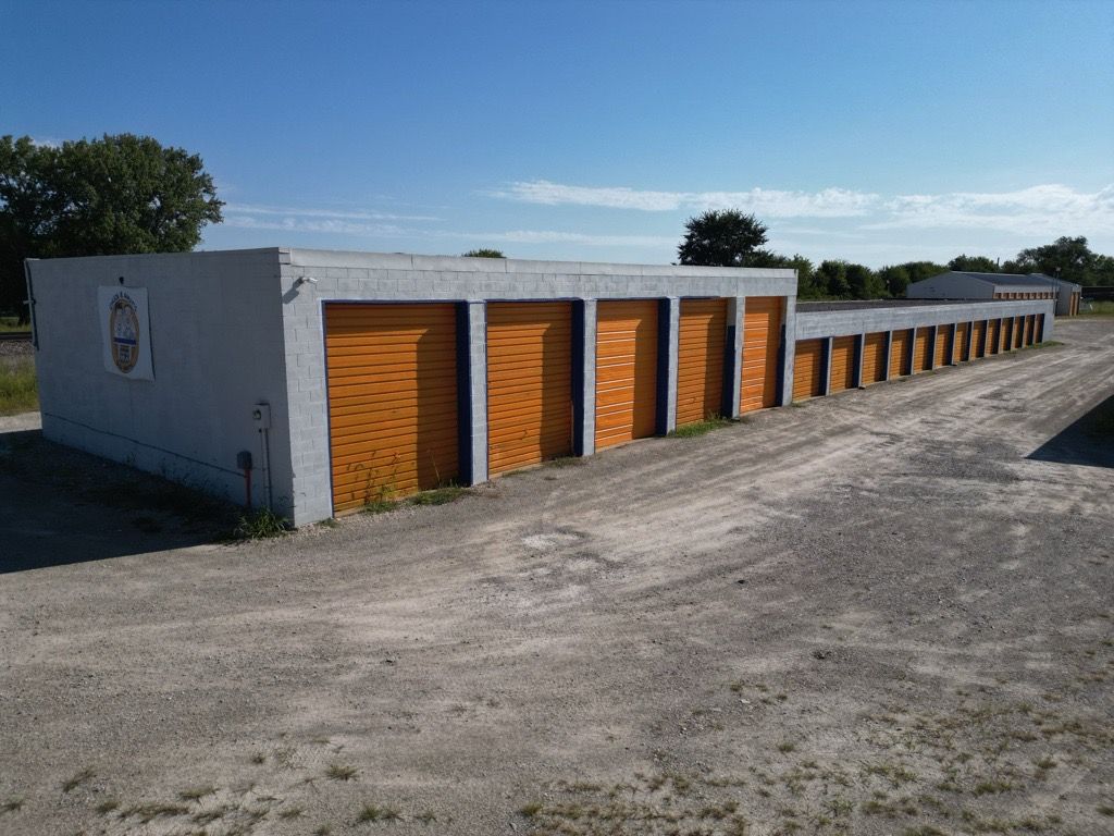 A row of blue doors on a white building