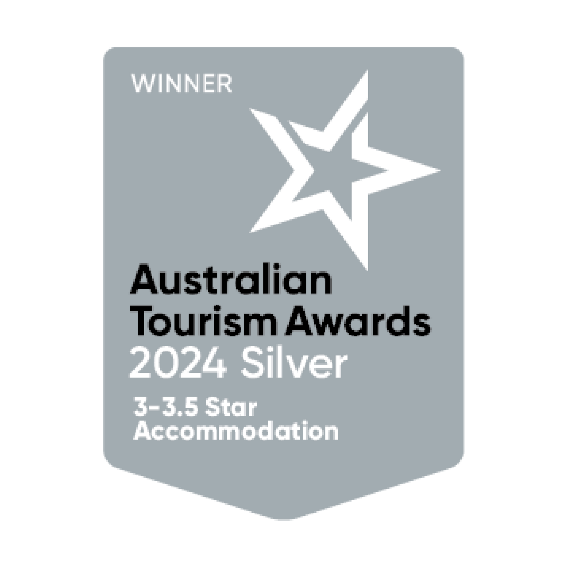 Silver award badge for the Australian Tourism Awards 2024. Features a star graphic and text indicating 3-3.5 Star Accommodation.