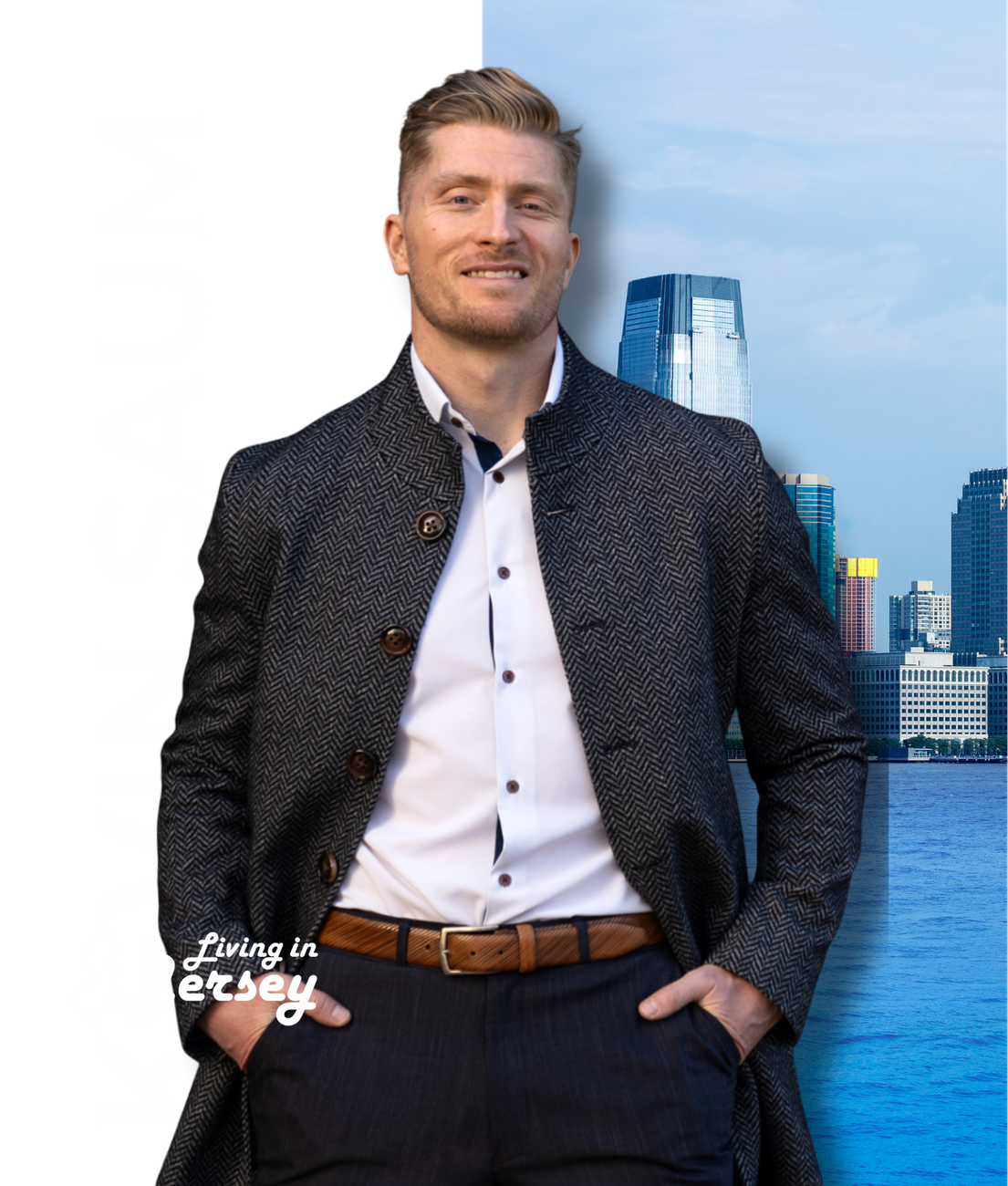 Kevin Saum | Living in Jersey Man standing by the water with city skyline behind him, wearing a dark jacket and smiling lightly