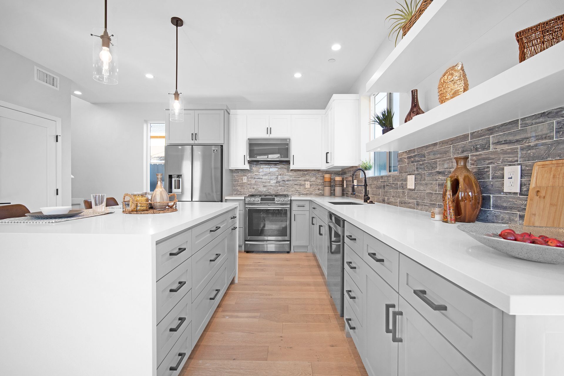 The full kitchen accessory dwelling unit (ADU) featuring plenty of space, an island, and modern all-electric appliances. 