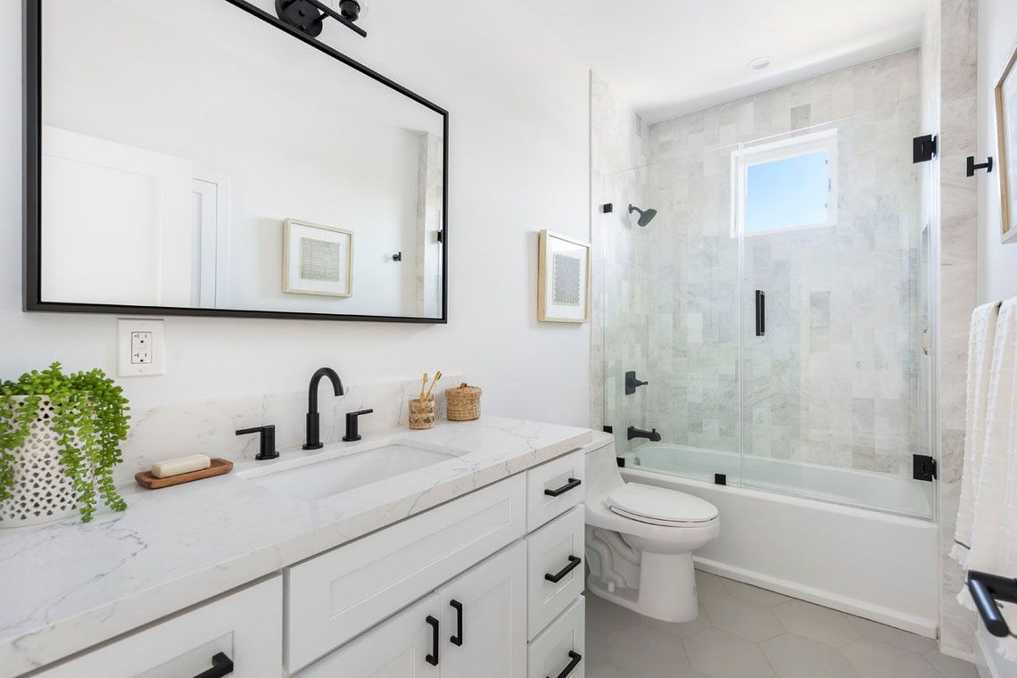 The private, ensuite, full bathroom in the master bedroom of an accessory dwelling unit (ADU) backyard home.
