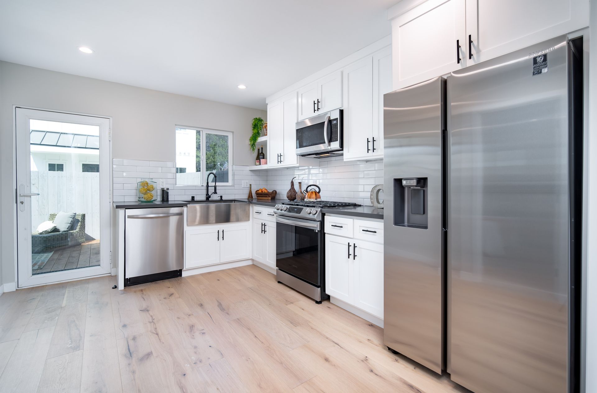 The full kitchen inside an accessory dwelling unit (ADU) backyard home in Los Angeles, CA featuring modern all-electric appliances.