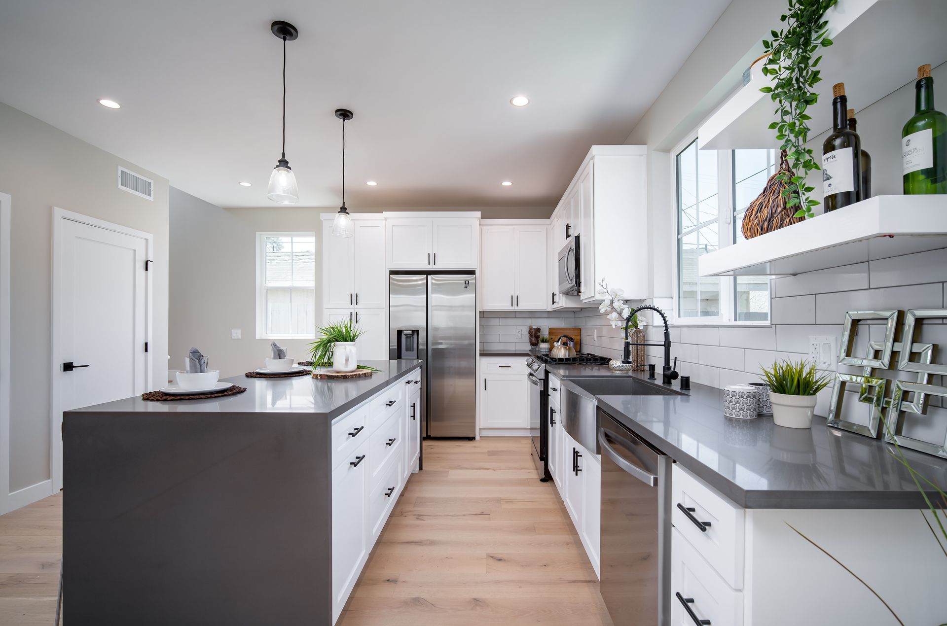 The full kitchen accessory dwelling unit (ADU) featuring plenty of space, an island, and modern all-electric appliances. 