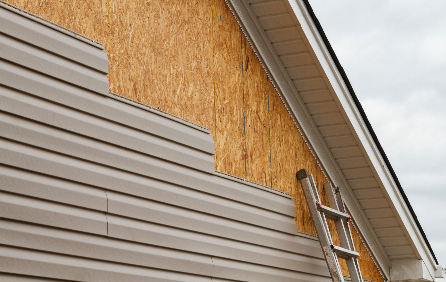 A ladder is attached to the side of a house.