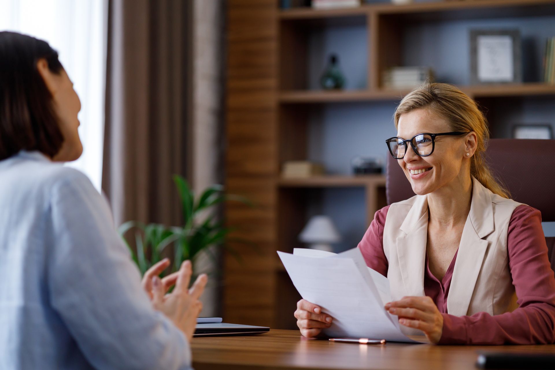A woman is interviewing a candidate.