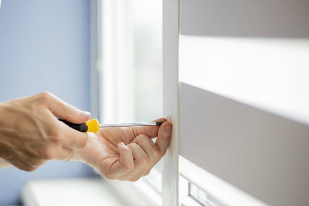 Man Repairing Window Blinds — Goulburn, NSW — Sun Solutions Home Improvement